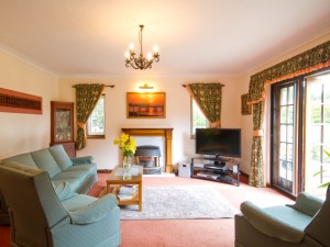 Lounge of cottage with pool